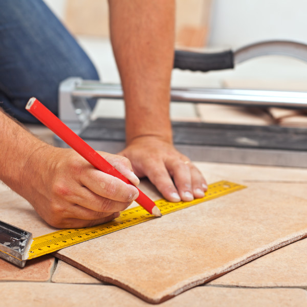 Over 55 Skills At Work - Man cutting floor tile